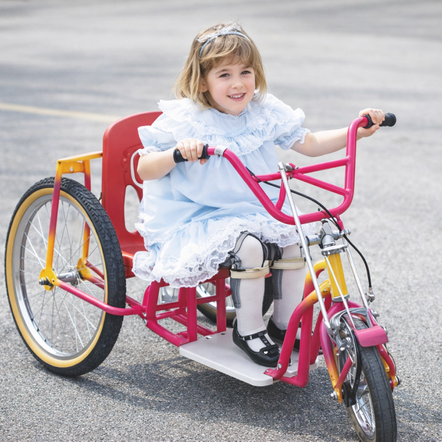 happy kid using a tricycle